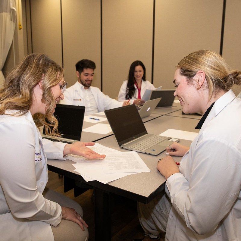 PA students studying around a table.